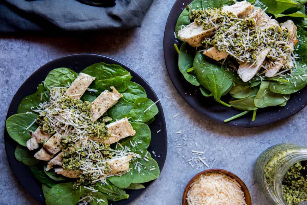 keto salad topped with pesto chicken strips