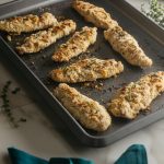 keto chicken tenders on a baking sheet