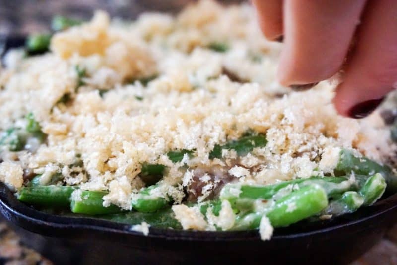Low Carb Green Bean Casserole crispy topping being spread on
