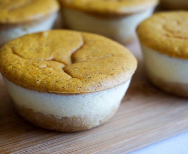 Keto Pumpkin Cheesecake layered desserts on a cutting board for service
