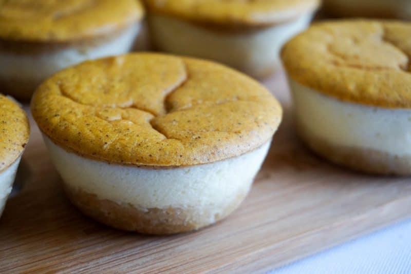 Keto Pumpkin Cheesecake layered desserts on a cutting board for service