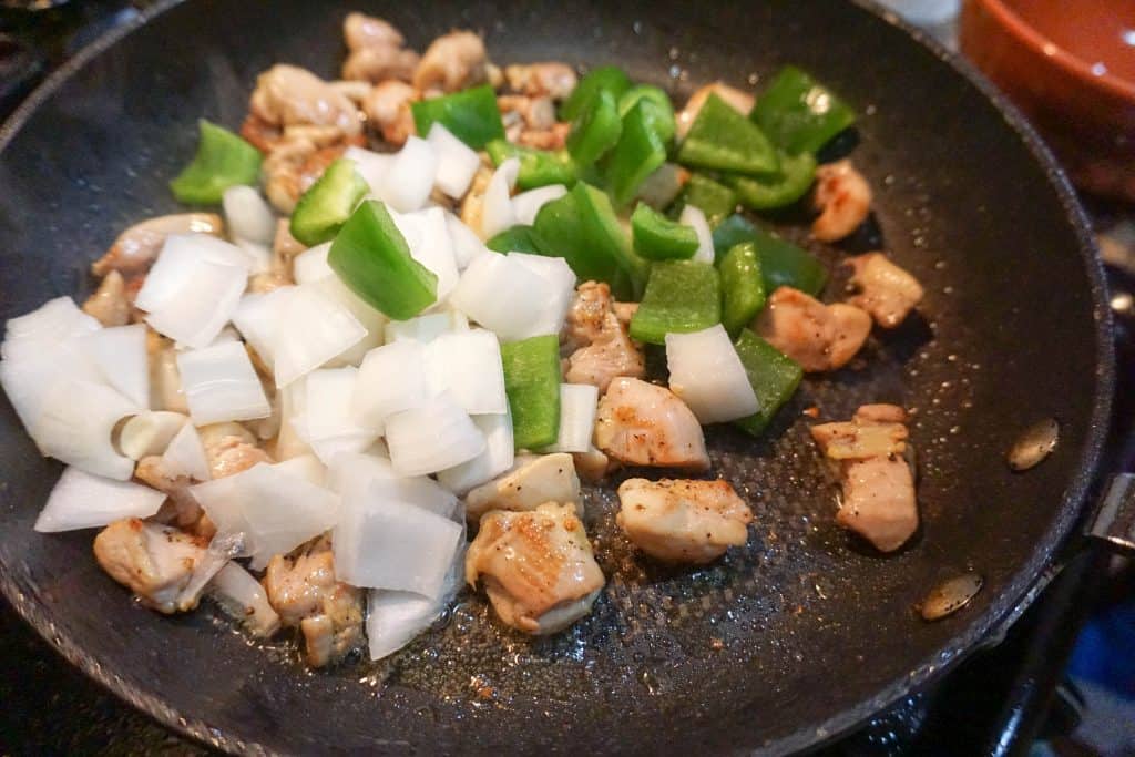 veggies for easy cashew chicken being sauteed in preparation for the final dish