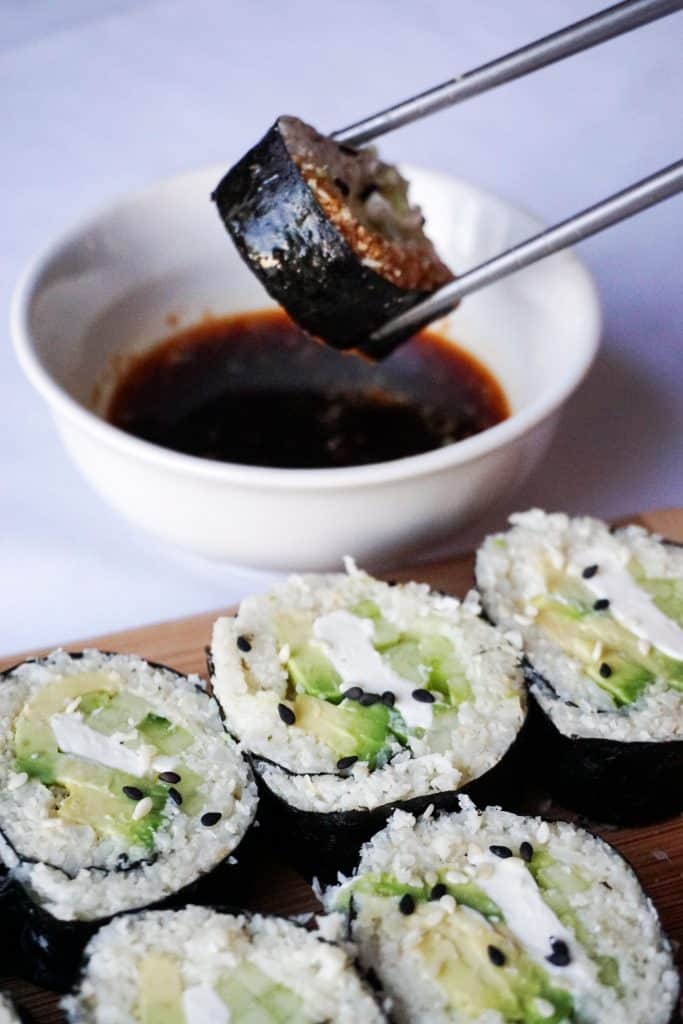 keto sushi dipped in soy sauce