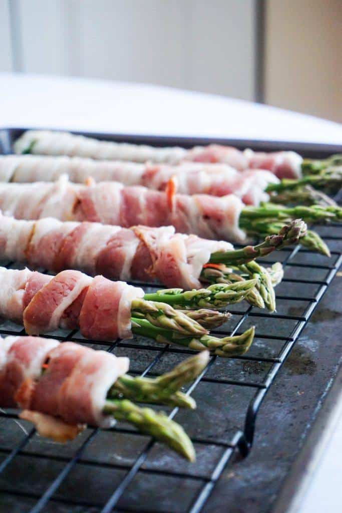 This Simple Keto bacon wrapped asparagus! A bundle of asparagus wrapped in thick cut bacon.
