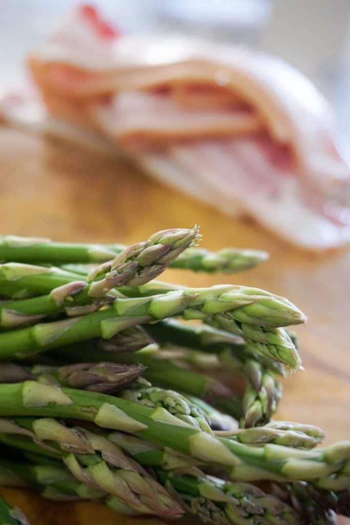 This Simple Keto bacon wrapped asparagus! A bundle of asparagus wrapped in thick cut bacon.