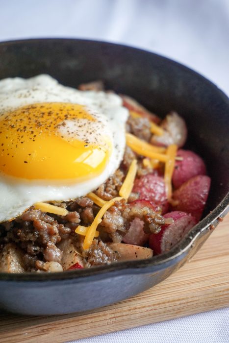 Keto Breakfast Bowl! Perfectly roasted radishes topped with sausage, cheese and a perfectly cooked egg!