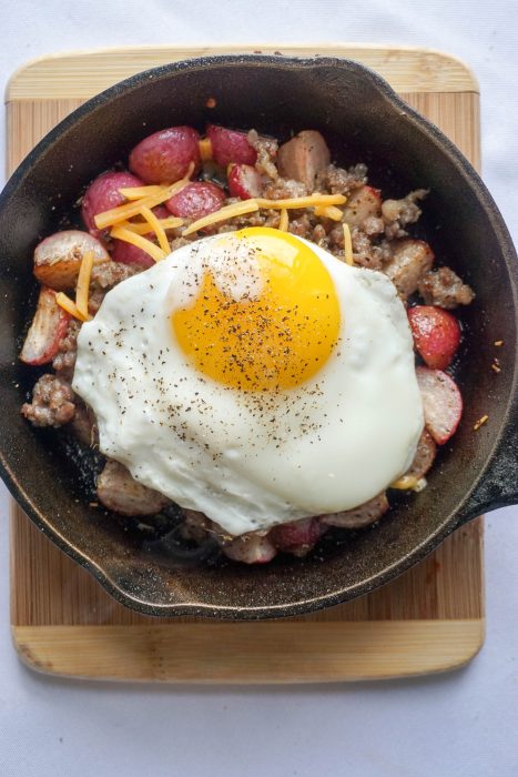 Keto Breakfast Bowl! Perfectly roasted radishes topped with sausage, cheese and a perfectly cooked egg!