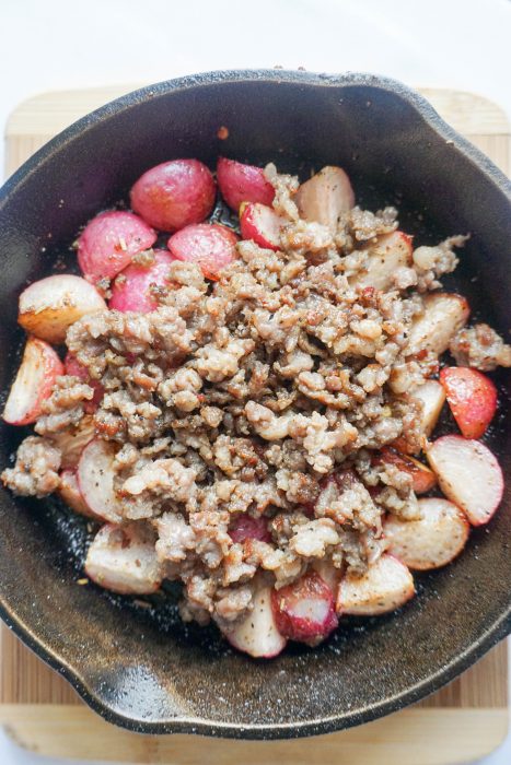 Keto Breakfast Bowl! Perfectly roasted radishes topped with sausage, cheese and a perfectly cooked egg!