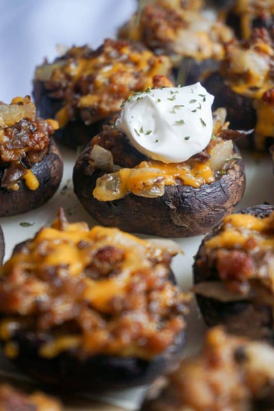 close up shot of mushrooms stuffed with sausage and cheese