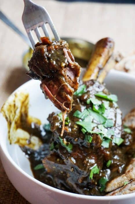 Our Curry Lamb Shanks Recipe is slow roasted and fall off the bone tender!