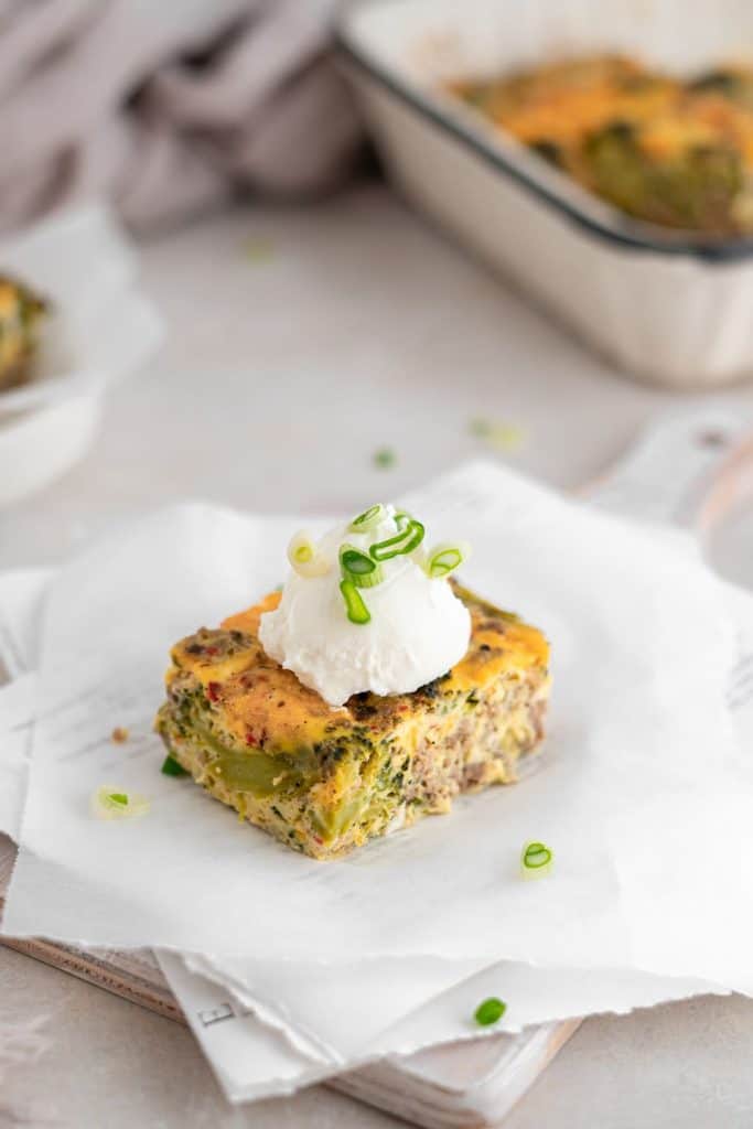 Keto breakfast Casserole Broccoli sausage casserole with a dollop of sour cream