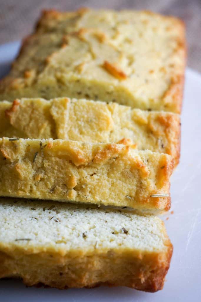 large slices of coconut flour bread on a cutting board