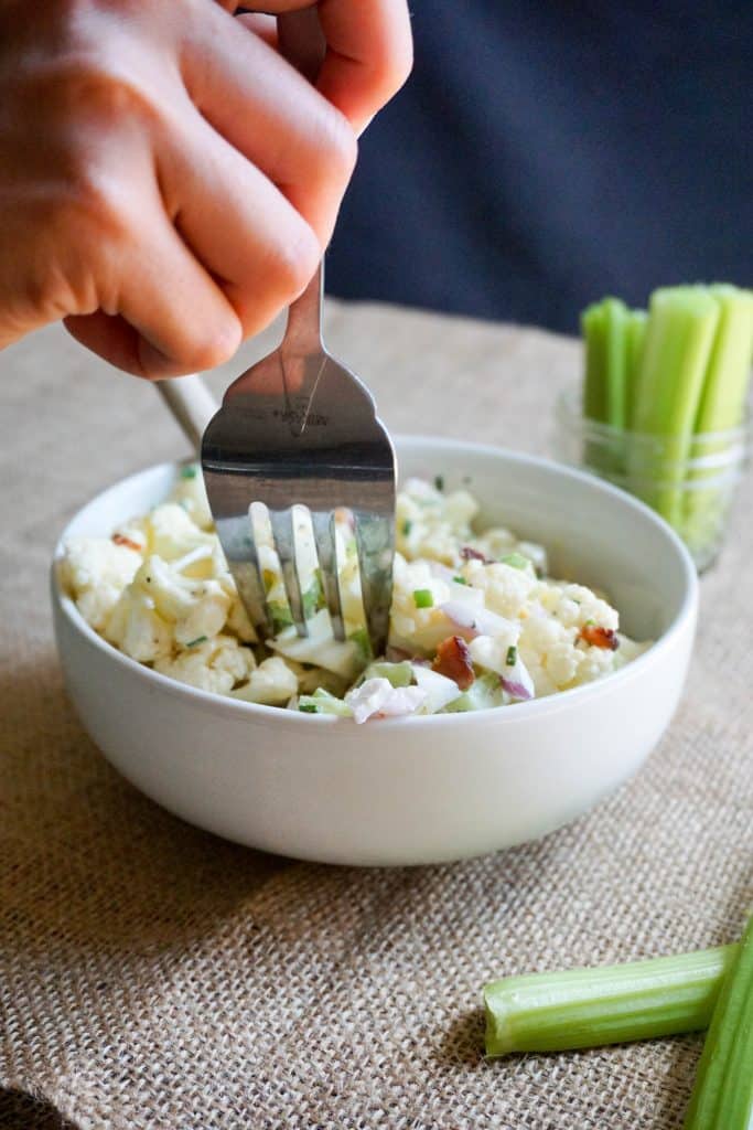 This Keto Cauliflower Salad recipe is the perfect summer time BBQ side dish packed with flavor and crunch in every bite!