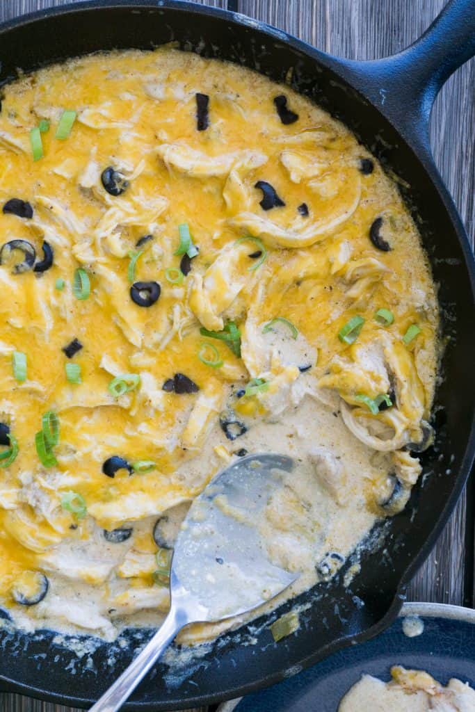 Our easy keto chicken enchilada casserole combines the flavors of a Mexican spice blend, creamy sour cream and green chilis to make this hearty, weeknight dinner recipe!