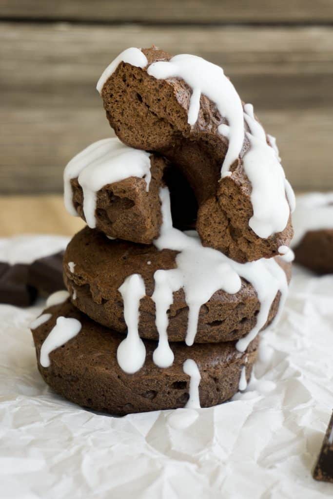 Low carb chocolate donuts stacked on parchment paper