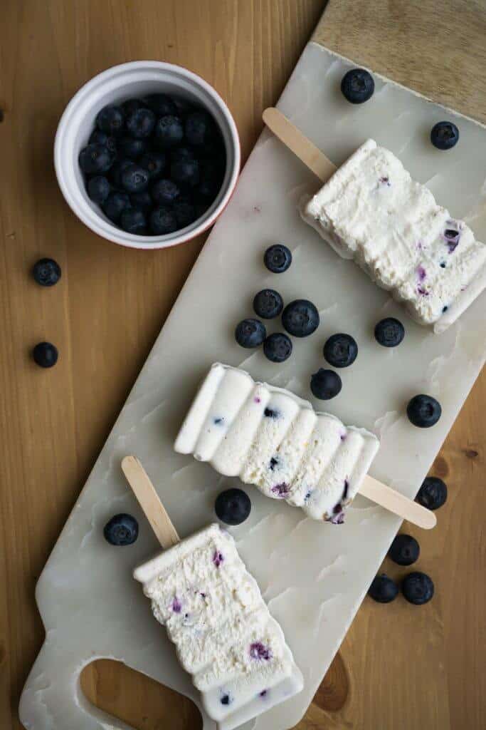 Our low carb, keto popsicles are made from a creamy blueberry, lemon cheesecake filling for the perfect guilt free treat!