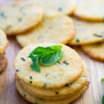 cheese crackers with fresh basil on top
