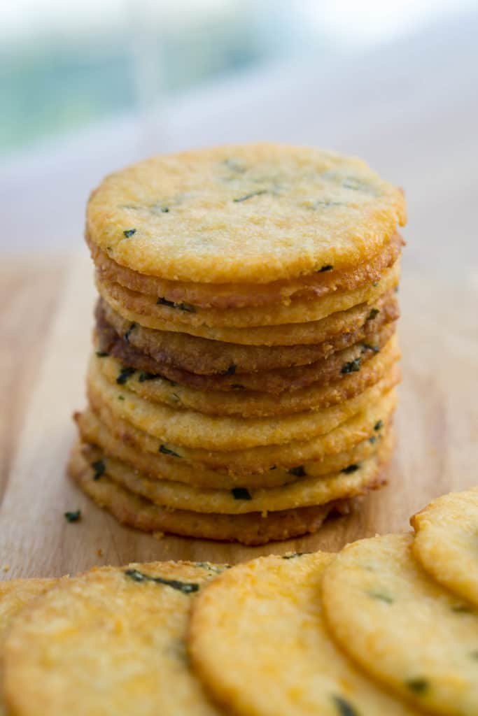 stack of ten low carb cheese crackers with herbs baked in