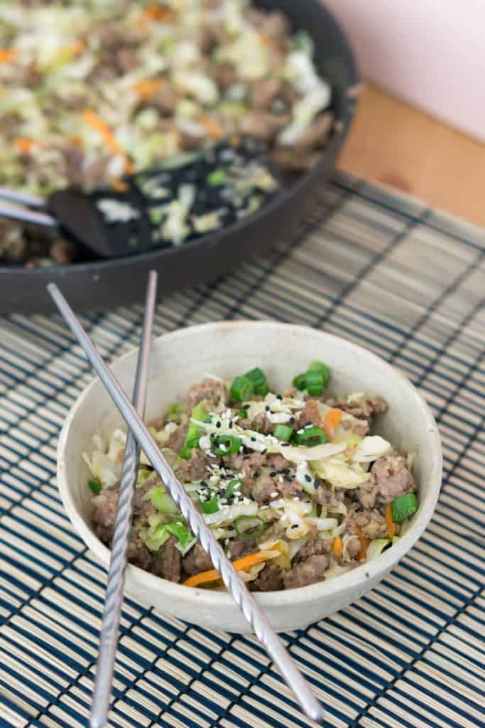 paleo vs keto egg roll in a bowl recipe consisting of cabbage ground beef and sesame seeds