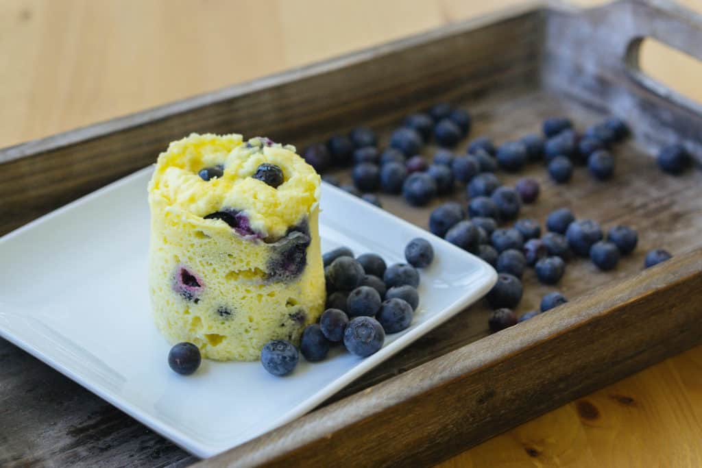 mug cake on a wooden serving tray