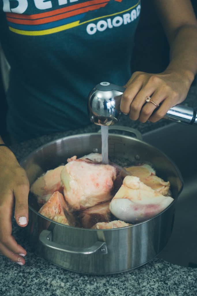 Our keto Instant Pot Bone Broth is simple to make and perfect for sipping on, using in stews and chilis, and getting in nutrients and electrolytes in a delicious way!