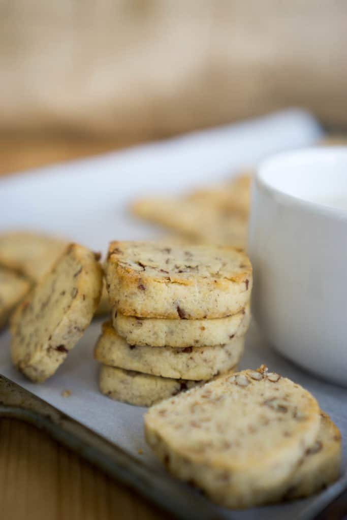 Shortbread stacked against a white mug