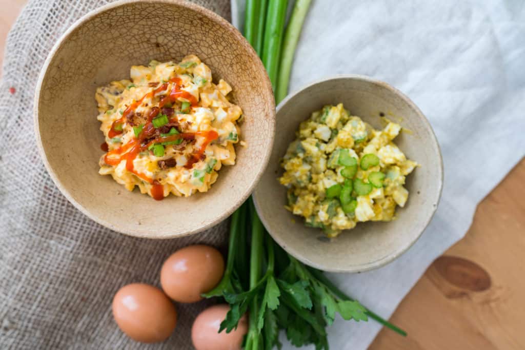 two bowls of keto salad made out of hardboiled eggs.