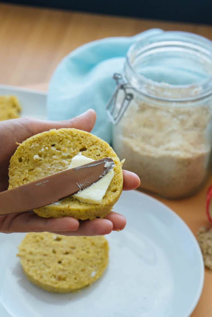 keto mug bread being spread with butter melting