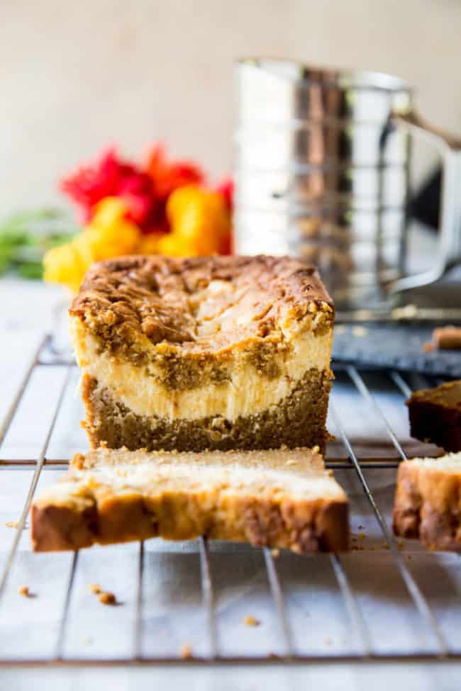 low carb pumpkin bread filled with cream cheese with a single slice out of it