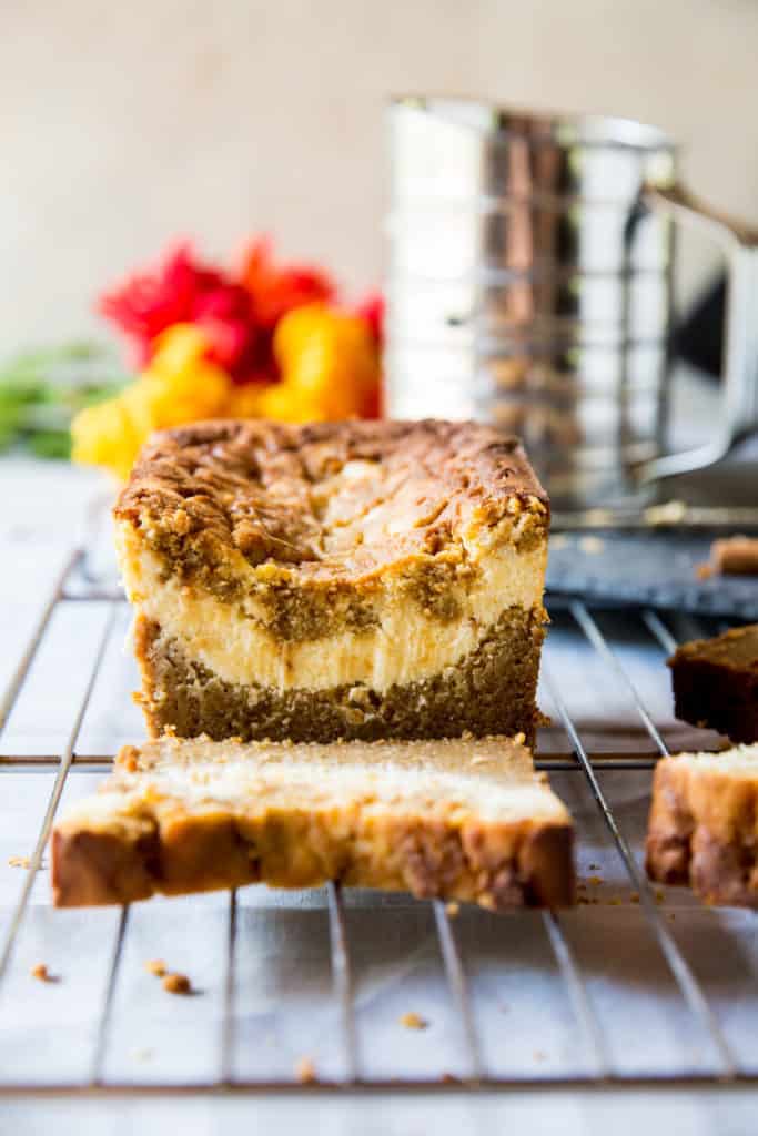 Low Carb Pumpkin Bread low carb pumpkin bread filled with cream cheese with a single slice out of it