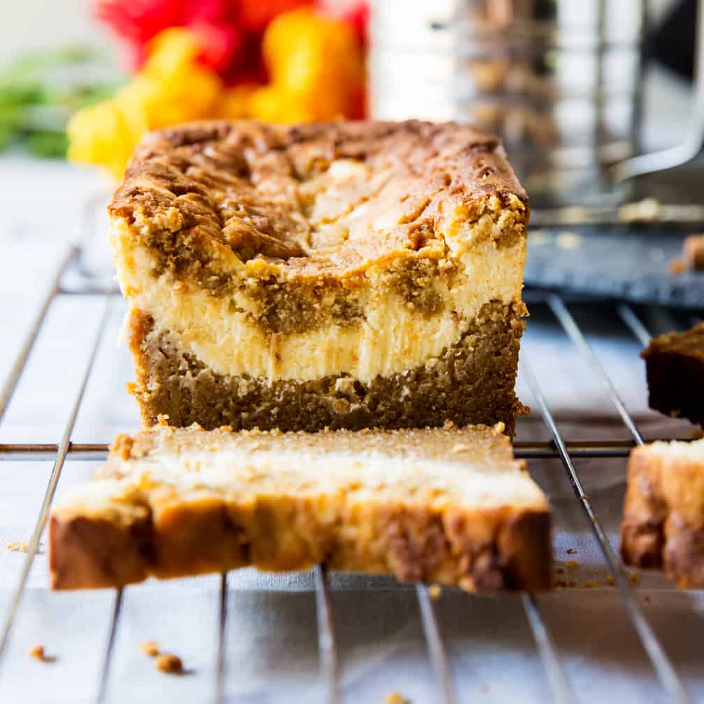 keto pumpkin recipes pumpkin bread with a stripe of cream cheese