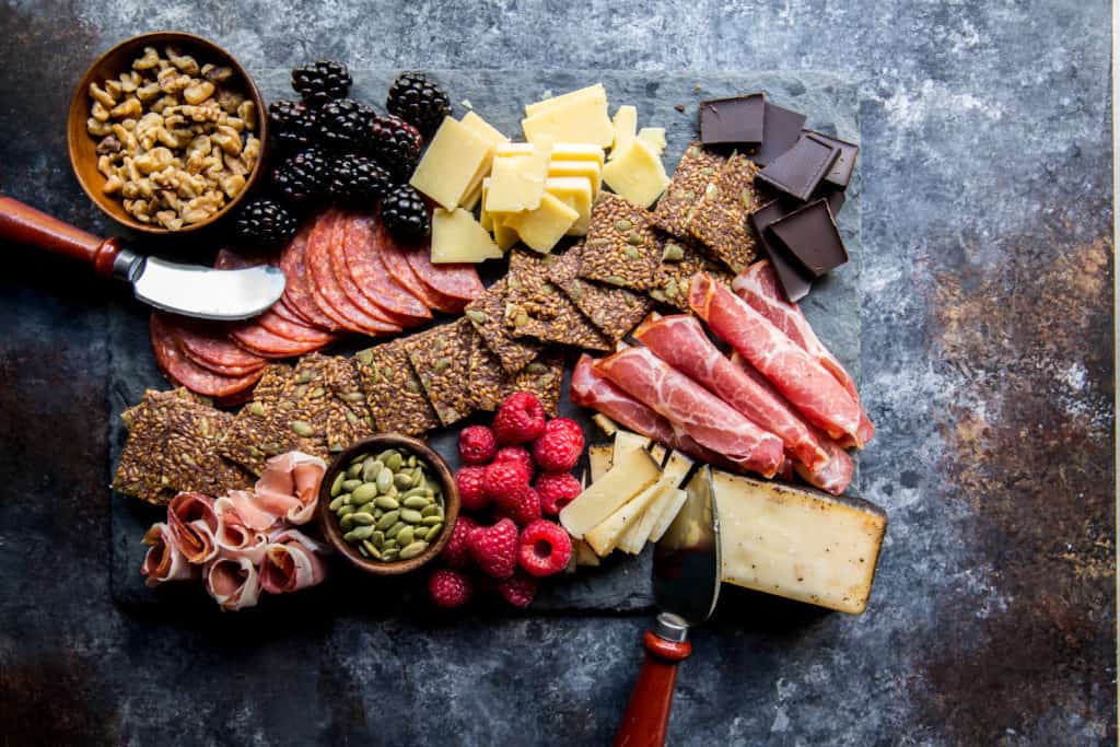 A great appetizer during the holiday season a platter of crackers. Berries, cheese, meats, and chocolates are perfect with crackers to hold people over until the big feast!