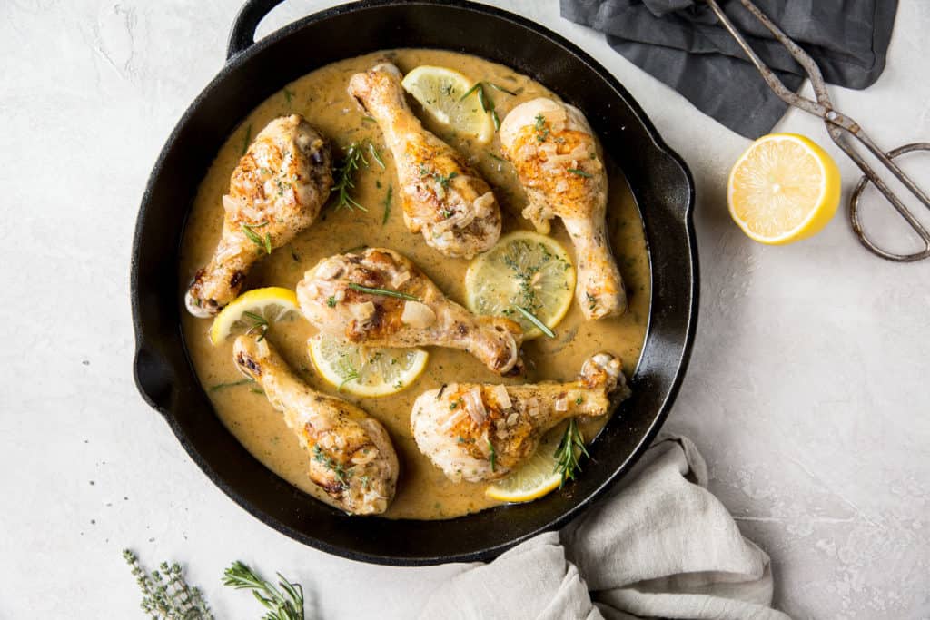 These Oven Baked Drumsticks combine tender chicken and a creamy butter and herb sauce for a busy weeknight dinner!
