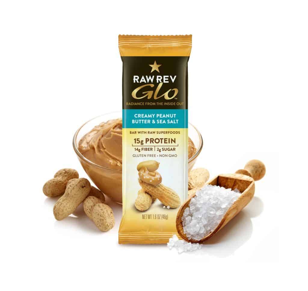 packaged bar in a posed photograph with peanuts peanut butter and salt around it