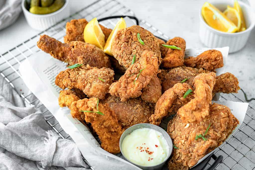 basket of fried chicken with dips