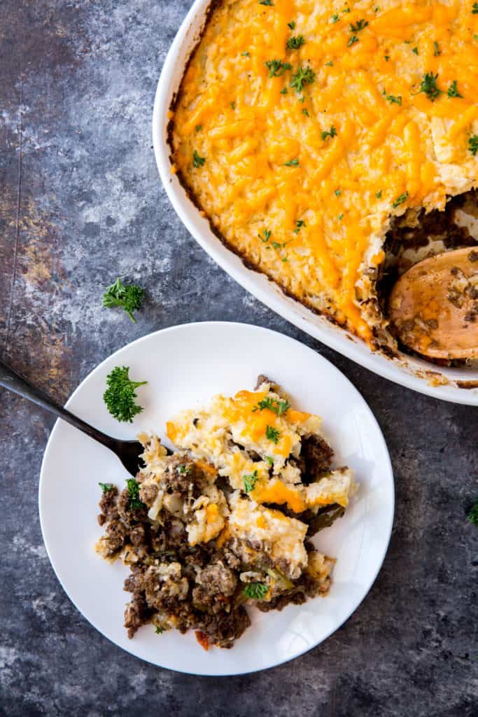 keto shepherd's pie scooping a serving out of a keto shepherds pie