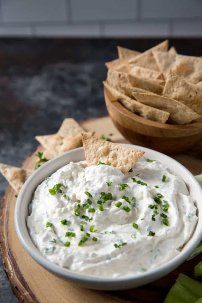 french onion dip served with keto chips and topped with scallions