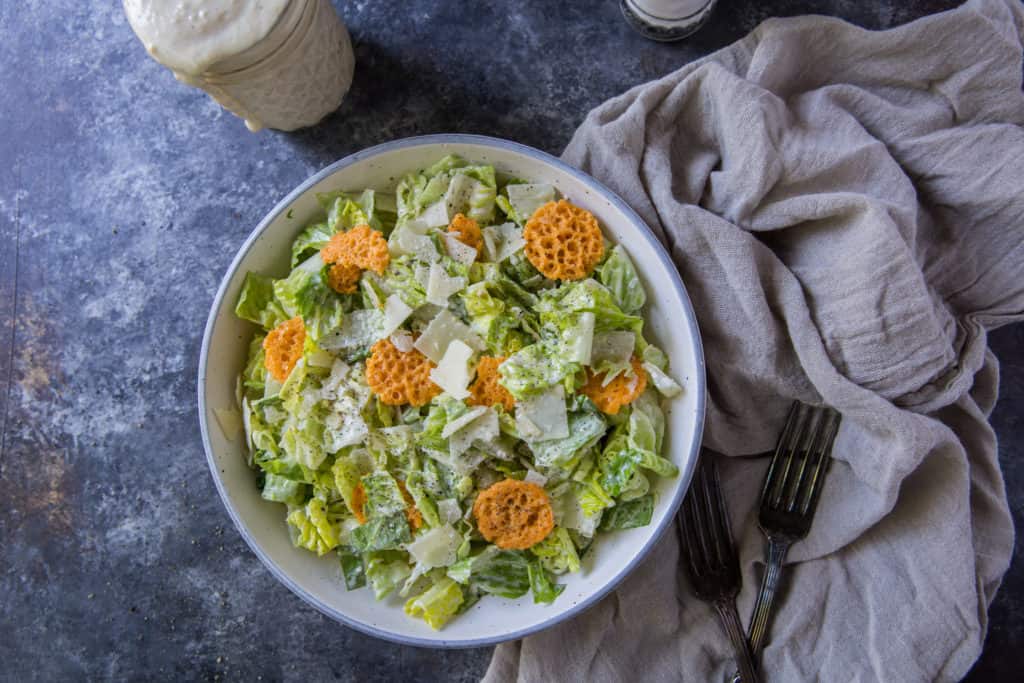 Keto Caesar Dressing keto caesar salad with dressing overhead shot
