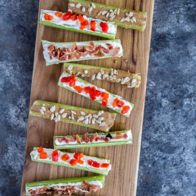 stuffed celery Stuffed celery three ways displayed on a wood cutting board
