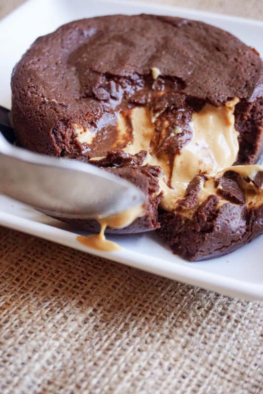 keto lava cake keto lava cake being cut open with a spoon