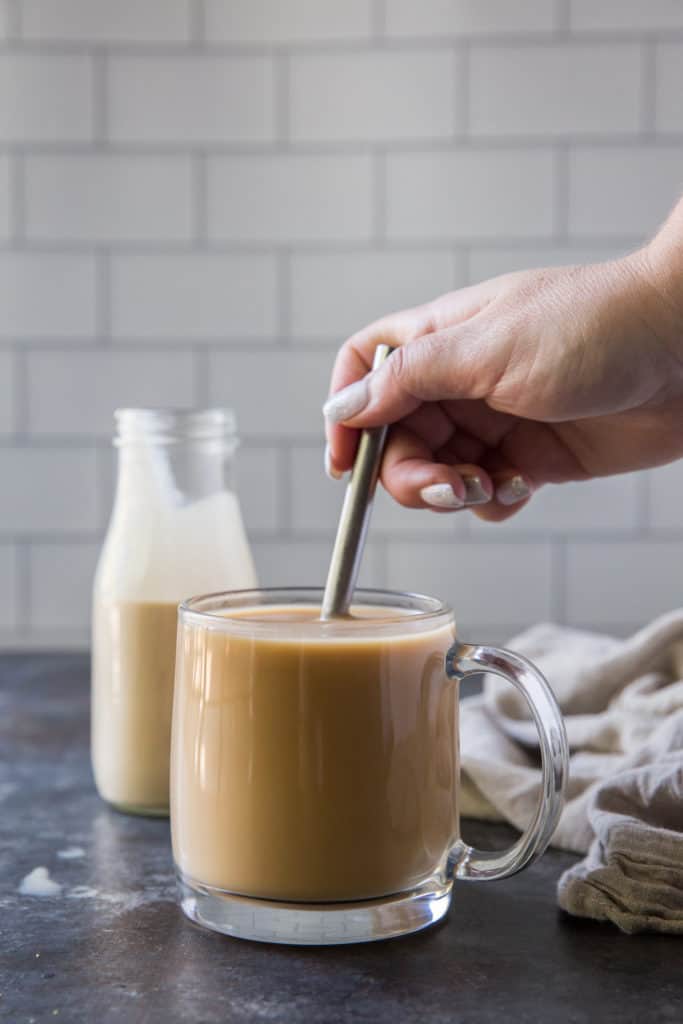 stirring ceamer into a coffee