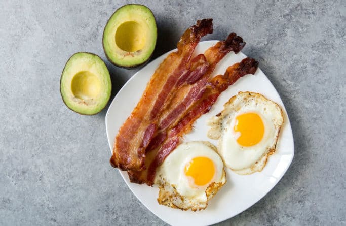 paleo vs keto breakfast showing avocados bacon and eggs