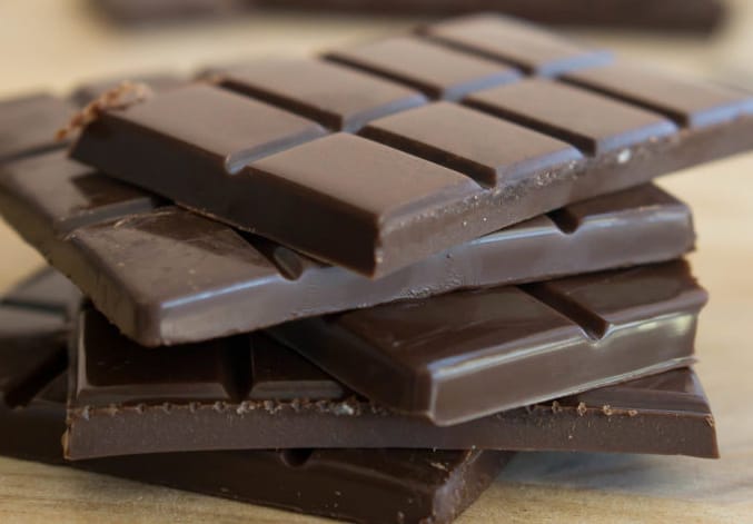 ketogenic chocolate bars stacked in a angled pattern