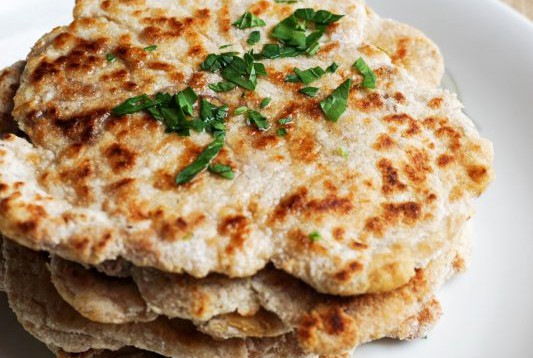 keto naan close up keto naan recipe stacked on a plate