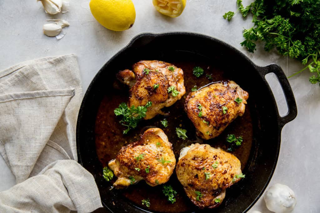 chicken thighs in a large cast iron skillet