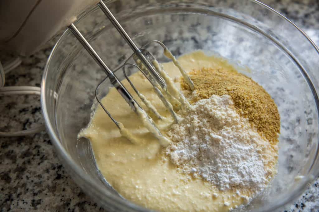 coconut flour cookies batter for coconut flour cookies in a glass bowl with a hand mixer