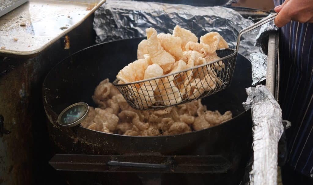 fryer full of pork being made