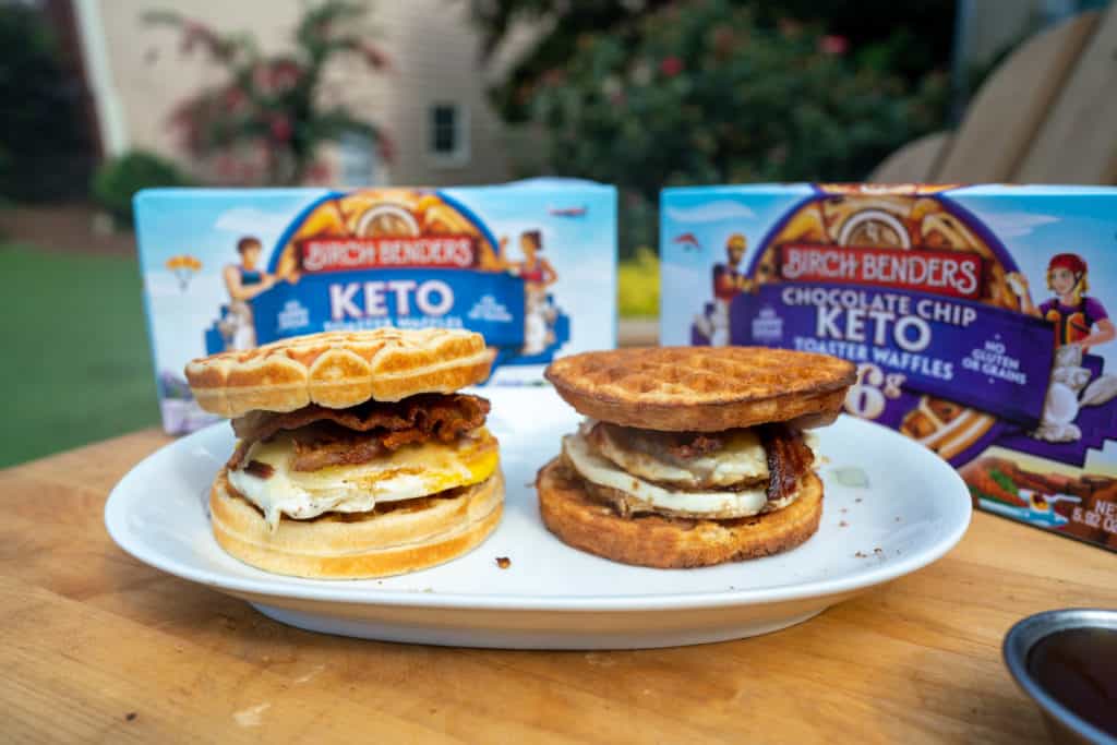 keto breakfast sandwich two keto breakfast sandwiches on a plate with maple syrup