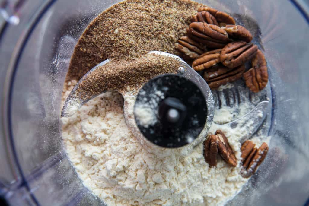 the ingredients to make keto energy balls in a food processor