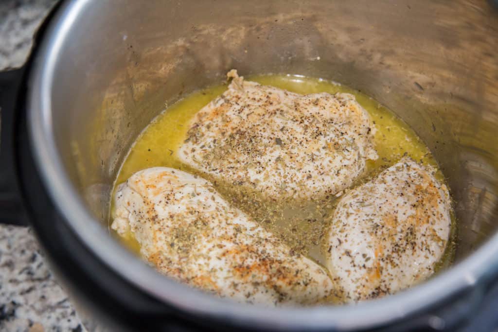 chicken breasts seasoned and cooked in a creamy butter sauce in the instant pot